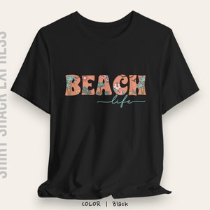 Retro font decorated with beach accents that says Beach life on a t-shirt