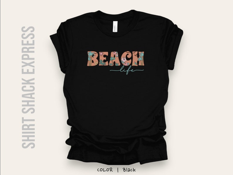 May include: Black t-shirt with a floral design and the text "Beach life" in a retro font.
