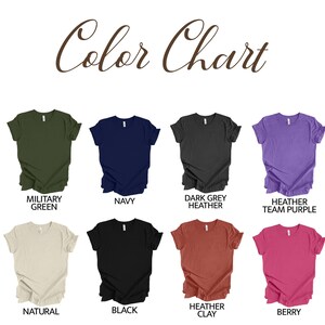 May include: Color chart showing 10 different t-shirt colors: Military Green, Navy, Dark Grey Heather, Heather Team Purple, Natural, Black, Heather Clay, Berry, White, and Ash.