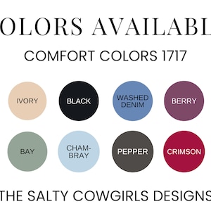 May include: Image displaying a color chart with the text "COLORS AVAILABLE" and "COMFORT COLORS 1717". The chart features eight color swatches: Ivory, Black, Washed Denim, Berry, Bay, Chambray, Pepper, and Crimson. The text "THE SALTY COWGIRLS DESIGNS" is at the bottom.