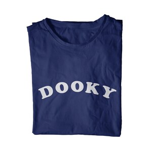 May include: A navy blue t-shirt with the word "DOOKY" printed in white on the front.