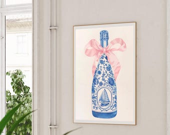 May include: A blue and white ceramic bottle with a pink ribbon tied around the neck. The bottle has a floral design and a sailboat on the front. The background is white.