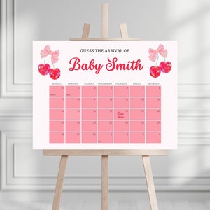 May include: A pink and white baby shower game with a calendar for guests to guess the arrival date of Baby Smith. The calendar has a pink background and the due date is highlighted in red.