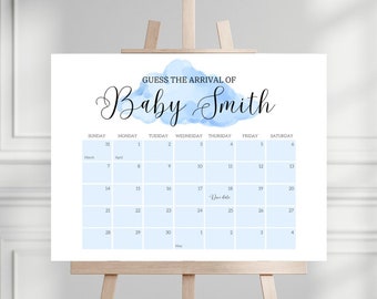 Op de afbeelding: Een blauwe en witte kalender met de tekst "Raad de komst van Baby Smith" bovenaan. De kalender is voor de maanden maart, april en mei. De uitgerekende datum is op de kalender gemarkeerd.