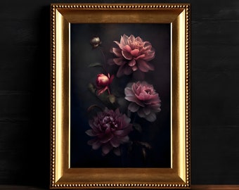 May include: A framed floral print featuring pink peonies against a dark background. The gold frame has a beaded edge. The artwork is displayed on a wooden surface, with a dark wall in the background.