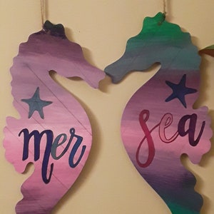 pair of wooden sea horses &quot;mer&quot; (french for sea) and &quot;sea&quot;