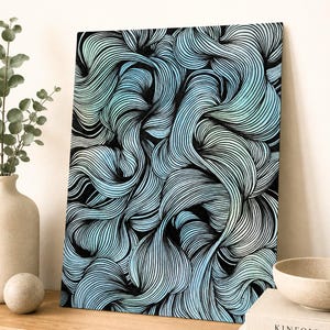 May include: A rectangular wall art piece featuring a dense, intricate pattern of flowing black lines that create a sense of movement. The background transitions between shades of light blue and white, highlighting the continuous, swirling linework.