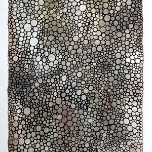 May include: Abstract artwork with a pattern of circles in shades of grey, brown, and white, outlined in black. The composition has a textured appearance, with a signature in the bottom right corner.