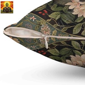 May include: A square throw pillow cover featuring a dark black background with a botanical pattern of light pink flowers, green leaves, and small red berries. The fabric has a white zipper closure along the side with a white metal pull tab.
