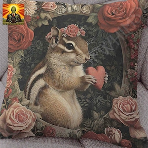 May include: A brown and white chipmunk wearing a flower crown holds a red heart in its paws. The chipmunk is surrounded by red and pink roses and green leaves.