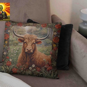 May include: A throw pillow with a brown and white Highland cow in a field of flowers. The cow is looking directly at the viewer. The pillow has a green, brown, and red floral border.