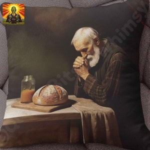 May include: Square pillow featuring a painting of an elderly person with a white beard, hands clasped in prayer. A loaf of bread sits on a wooden cutting board, with a jar of liquid beside it. The image has a vintage, rustic aesthetic.