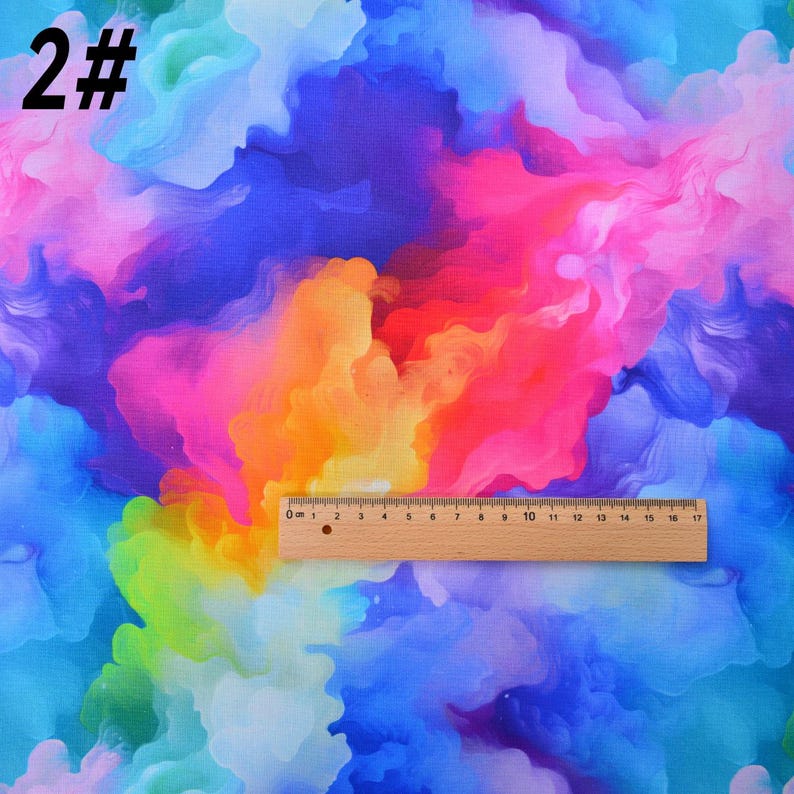 May include: Abstract colorful fabric with a rainbow of colors, including blue, purple, pink, orange, yellow, and green. The fabric has a marbled or swirled pattern.