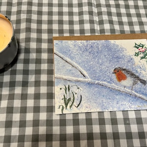Carte aquarelle de merle de Noël