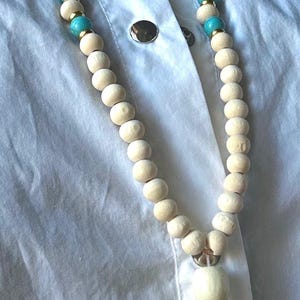 Boho necklace with wooden beads and turquoise | Handmade jewelry with a gold coin pendant | Handmade ethnic necklace for women