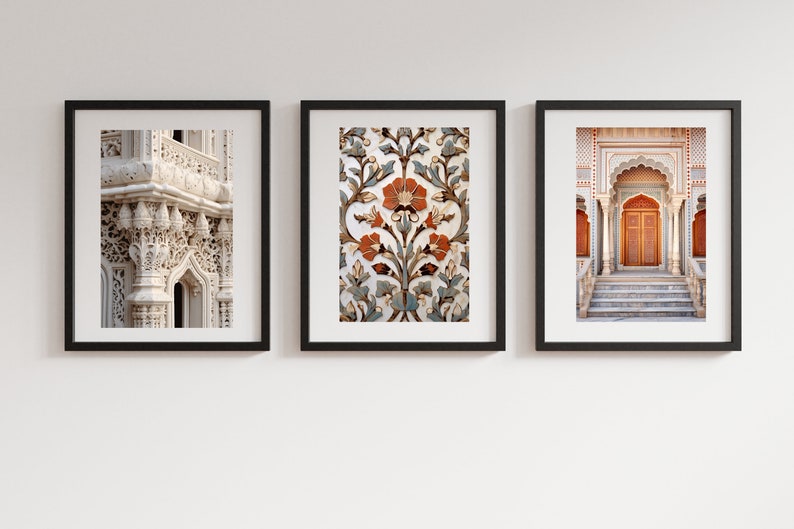 May include: Three framed prints depicting intricate architectural details from India. The left print shows a close-up of a white stone archway with ornate carvings. The centre print features a floral pattern in shades of blue, orange, and white. The right print shows a doorway with a wooden door and steps leading up to it.