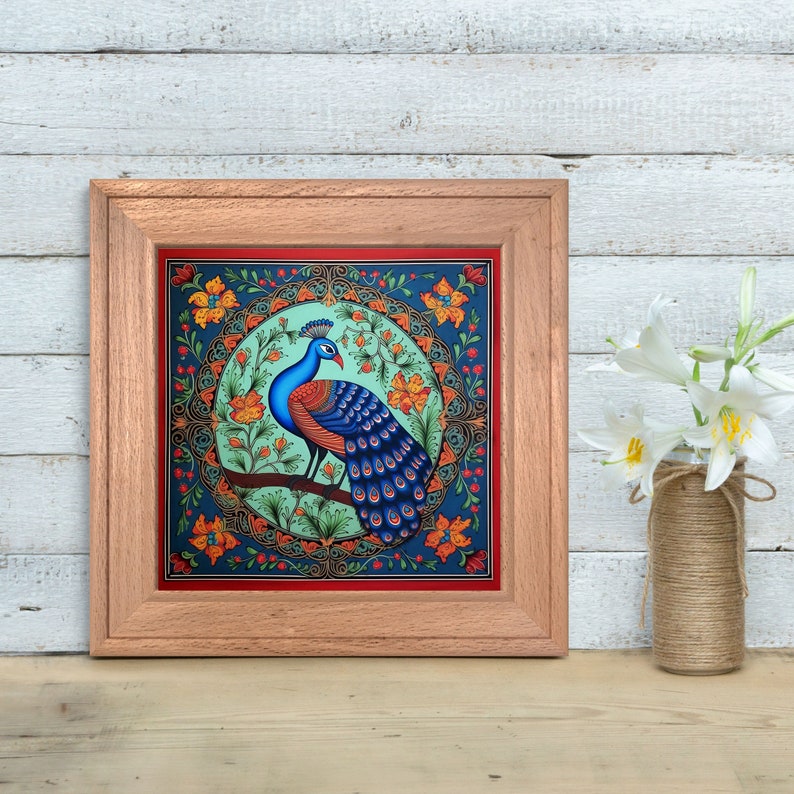 May include: A framed artwork featuring a peacock with blue and green feathers, standing on a branch in a circular floral design. The background is a dark blue with red and orange accents.