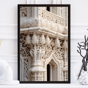 May include: A framed photograph of a white stone building with intricate carvings and a balcony. The building is a light beige colour and the carvings are detailed and ornate.