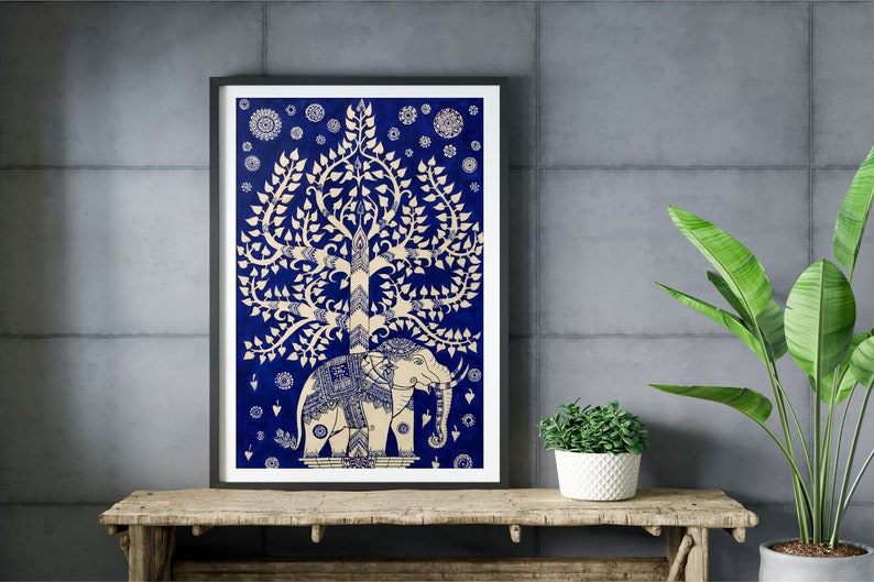 May include: A framed print of a blue and white illustration of a tree with an elephant standing beneath it. The tree has many branches and leaves, and the elephant is decorated with intricate patterns. The background is a dark blue color.