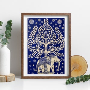 May include: A framed print of a white elephant standing under a white tree with blue leaves on a blue background. The tree is a traditional Thai design.