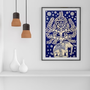 May include: A white elephant with intricate details stands under a white tree with a blue background. The tree has a large canopy and is surrounded by small white flowers. The image is framed in black.