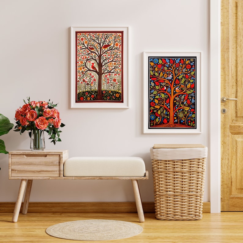 May include: Two framed art prints of colorful tree of life designs with birds and flowers. The prints are hanging on a white wall above a wooden bench with a wicker basket.