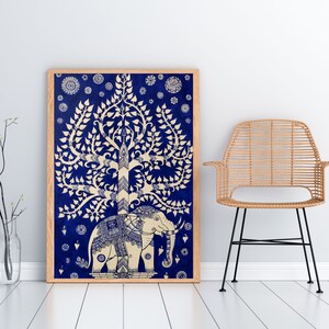 May include: A framed print of a white elephant standing under a white tree with blue leaves on a blue background. The tree is stylized and has a circular pattern at the top. The elephant has a detailed design and is facing the right.
