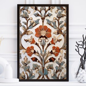 May include: A framed print of a traditional floral pattern in shades of blue, brown, and orange on a white background. The pattern features intricate details and a symmetrical design.