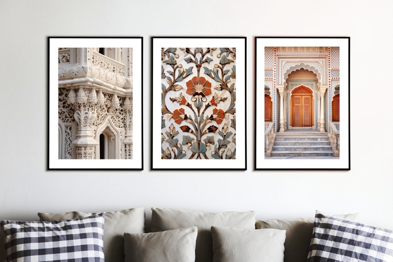May include: Three framed prints depicting intricate architectural details from India. The left print shows a close-up of a white stone archway with ornate carvings. The centre print features a floral pattern in shades of blue, green, and orange. The right print shows a doorway with a red wooden door and a set of steps leading up to it.