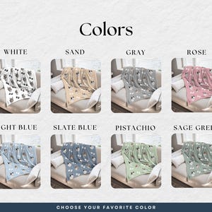 a selection of colored pet blankets, each with a different pattern and color, arranged in a grid format.