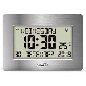 May include: A silver digital clock with a brushed metal finish displays the date, time, and temperature. The clock shows Wednesday, 30 December 2019, 10:30 am, and 25 degrees Celsius.
