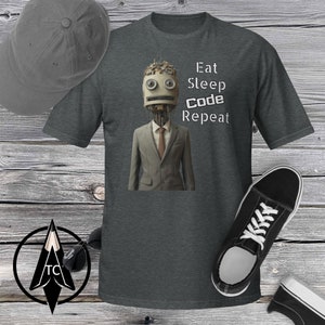 May include: A dark heather grey t-shirt featuring a robot wearing a suit and tie. The text "Eat Sleep Code Repeat" is printed on the shirt.
