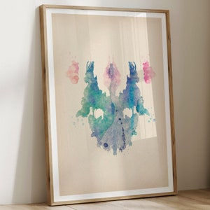 May include: A symmetrical abstract watercolor painting in shades of blue, green, and pink. The colors are blended together to create a soft, ethereal effect. The painting is framed in a simple wooden frame.