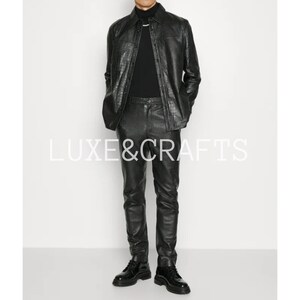 May include: A black leather jacket and matching pants with a crocodile-embossed pattern. The jacket has a button-up front and long sleeves. The pants have a slim fit and a straight leg.