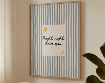May include: A framed wall art print with a light wood frame. The artwork features a striped background in shades of blue and white. A white square in the center has the text "Night night, Love you." with a yellow star and crescent moon.