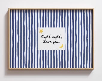 May include: A framed print with a blue and white striped background. A white square in the center features the text "Night night, Love you." with a yellow star and crescent moon illustration. The frame is a light brown color.