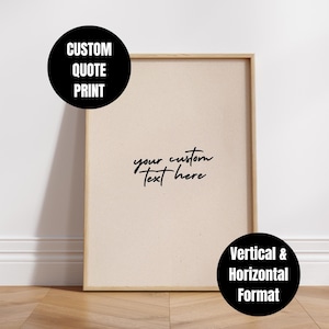 May include: A framed print with a beige background and a wooden frame. The print features the text "your custom text here" in a handwritten style. Two black circles with white text read "CUSTOM QUOTE PRINT" and "Vertical & Horizontal Format".