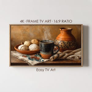 May include: A framed still life painting featuring a rustic scene. A steaming mug of coffee sits next to a bowl of pastries and a decorative vase. The artwork is labeled "4K FRAME TV ART 16:9 RATIO" and "Easy TV Art".