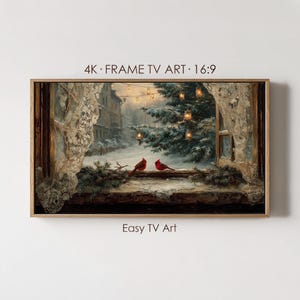 May include: A digital artwork for a frame TV titled 4K FRAME TV ART 16:9 and Easy TV Art. The scene shows two red cardinals perched on a snowy windowsill, framed by white lace curtains, looking out at a winter landscape with a lit pine tree.