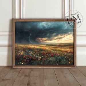 May include: A framed painting depicting a stormy landscape with a field of wildflowers in the foreground. A lightning bolt strikes in the distance, while the sky is filled with dark clouds. The sun is setting in the background, casting a warm glow over the scene.