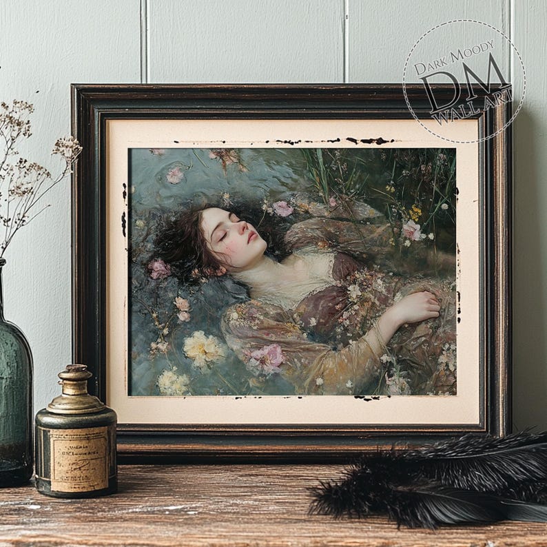 May include: Framed art print featuring a woman floating in water, surrounded by flowers. The artwork has a vintage aesthetic with soft colors and a dreamy quality. The frame is dark brown with distressed edges. The text "Dark Moody Wall Art" is in the upper right corner.