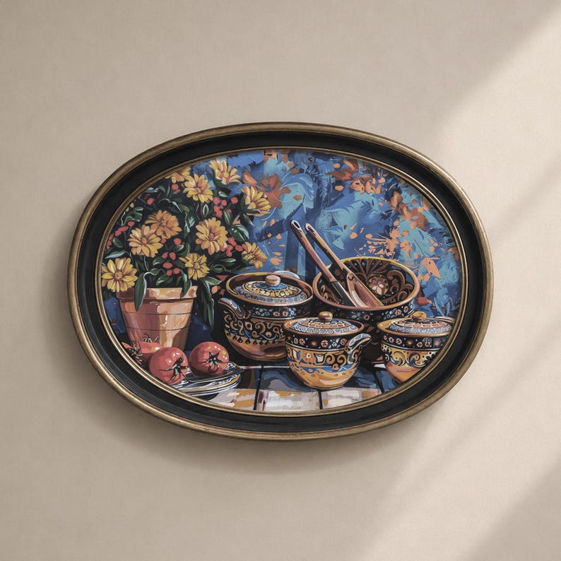 May include: Oval wall art featuring a still life with a floral arrangement, decorative bowls, and serving spoons. The artwork has a black and gold frame. The background is a blue and orange floral pattern. The bowls and pots have a gold and blue design.
