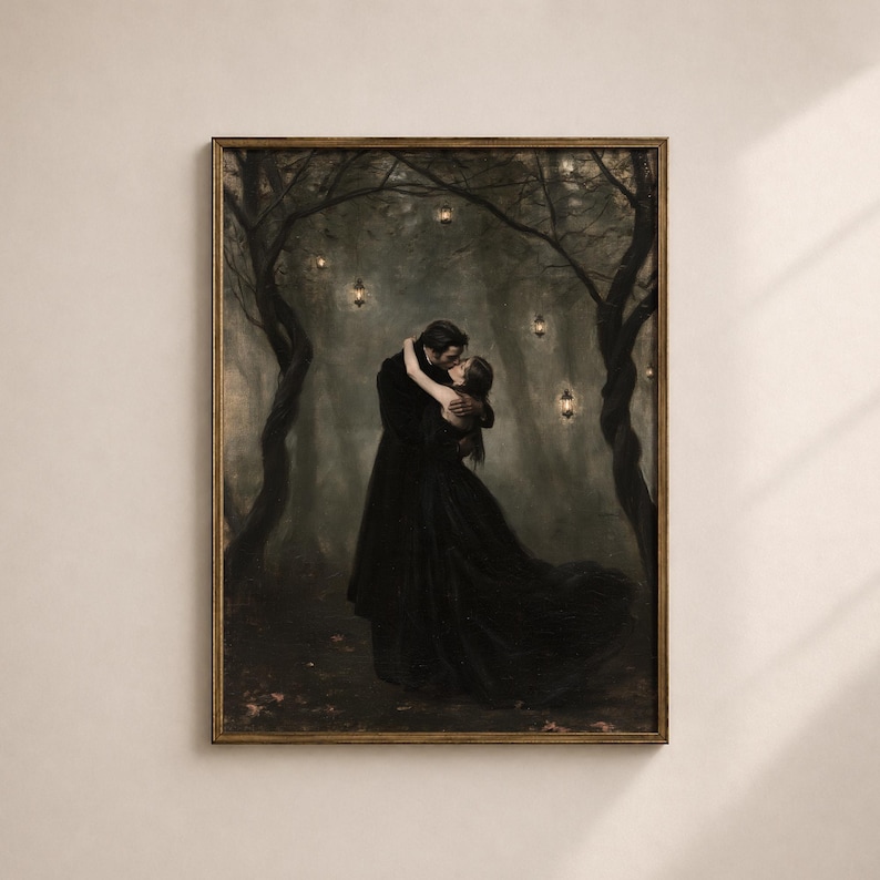 May include: A framed wall art print depicting two figures in long black clothing embracing and kissing in a dark, misty forest. The scene is illuminated by several small, glowing lanterns hanging from the twisted, dark tree branches above.
