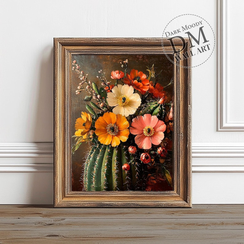 May include: A framed painting of a still life featuring a cactus with a variety of colorful flowers in shades of orange, yellow, pink, and white. The flowers are arranged in a vase-like shape, with the cactus serving as the base.