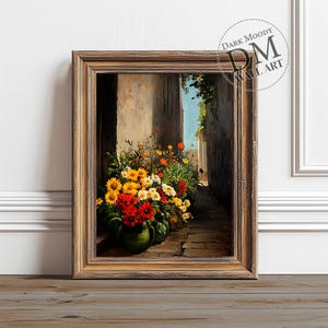 Peut inclure: Une peinture encadrée représentant une ruelle étroite avec un bouquet de fleurs jaunes, rouges et blanches dans un pot en terre cuite. Les fleurs sont au premier plan de la peinture, et la ruelle est en arrière-plan.