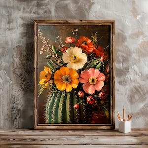 May include: A framed painting of a still life featuring a cactus with blooming flowers in shades of pink, yellow, and orange. The cactus is green and has many spines.