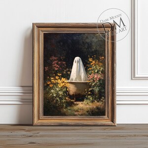 May include: A framed print of a vintage painting featuring a white ghost in a bathtub surrounded by flowers. The artwork has a dark, moody aesthetic with a gold-toned frame. The print is labeled "Dark Moody Wall Art".