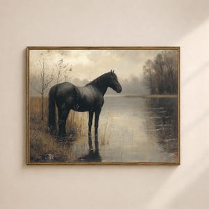 May include: A framed vintage-style painting depicts a black horse standing in a body of water. The artwork has a muted color palette with a gold-colored frame. The horse is the focal point, with a serene, natural landscape in the background.