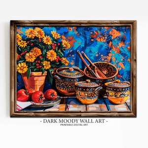 May include: A framed print of a still life featuring a terracotta pot of yellow flowers, red tomatoes, and decorative ceramic bowls with lids. The background is a vibrant blue with orange accents. The text at the bottom reads "DARK MOODY WALL ART - Printable Digital Art."
