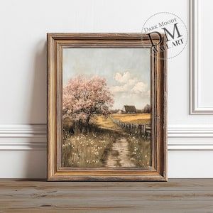 May include: A framed painting of a country scene with a farmhouse in the distance, a dirt road leading to it, and a pink flowering tree in the foreground.